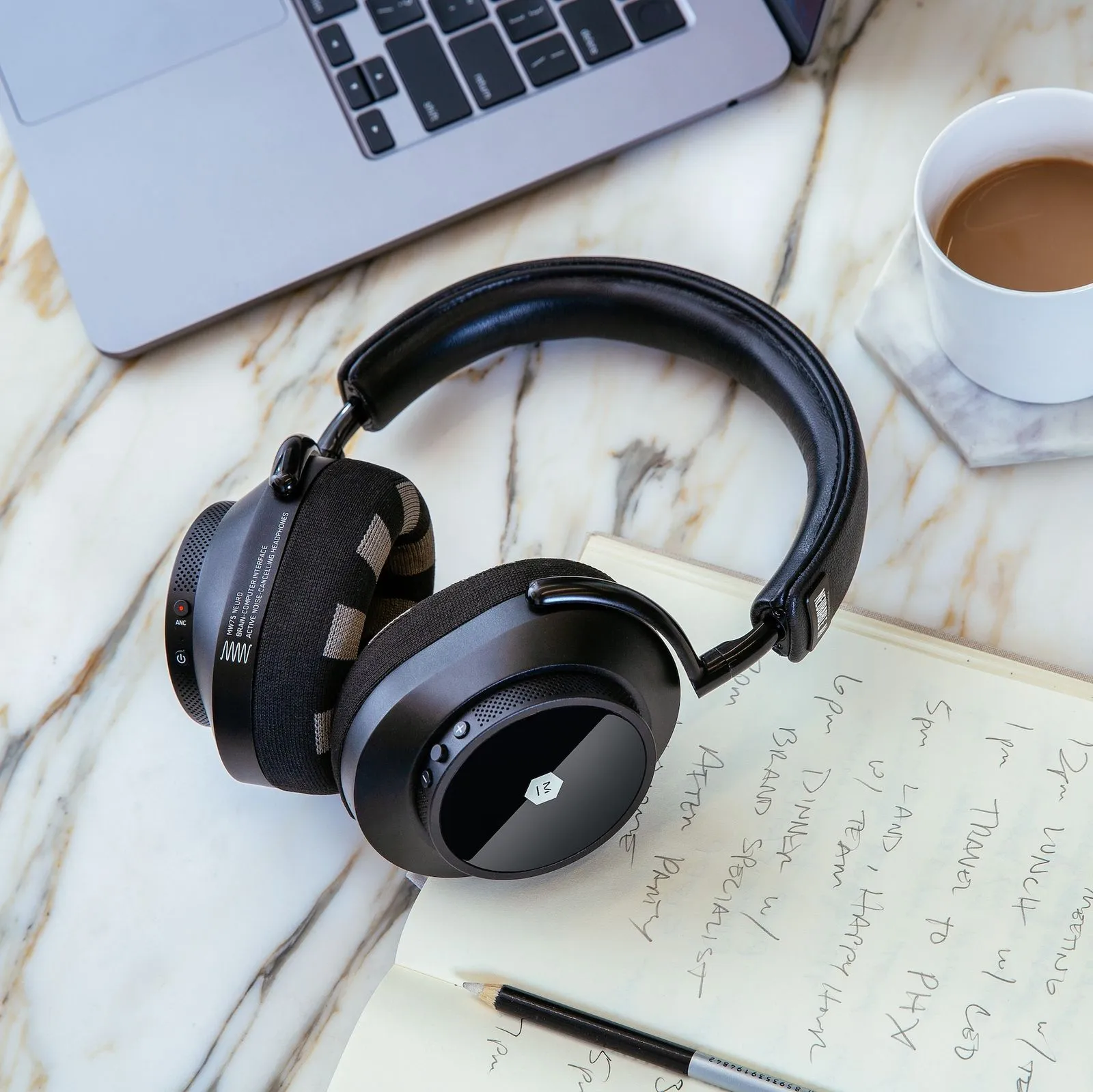 Neurable MW75 Neuro EEG headphones while working at desk